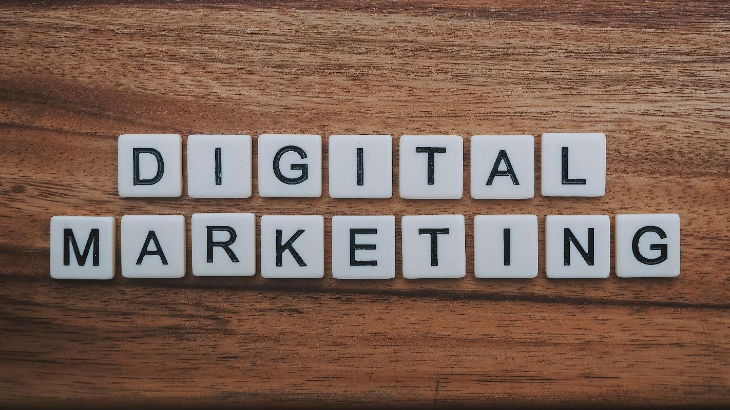 Scrabble letters spelling digital marketing on a table